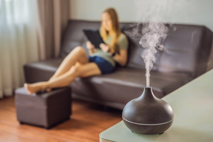 a woman using a humidifier