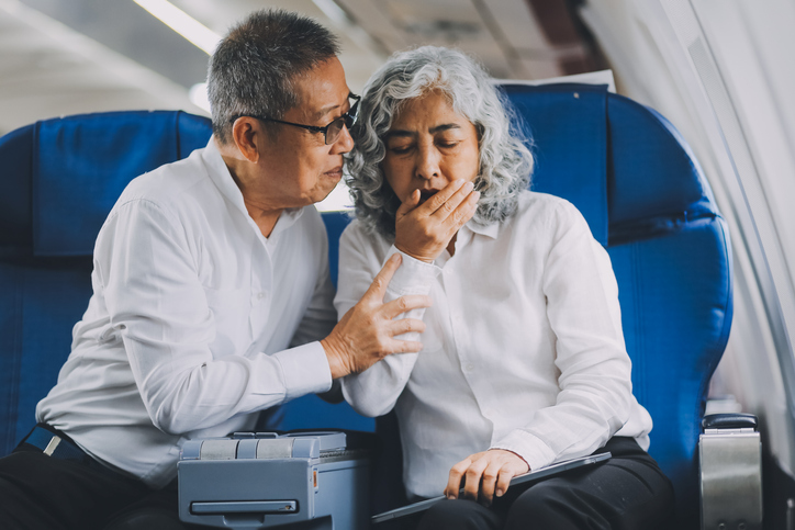 a couple traveling while the wife got sick