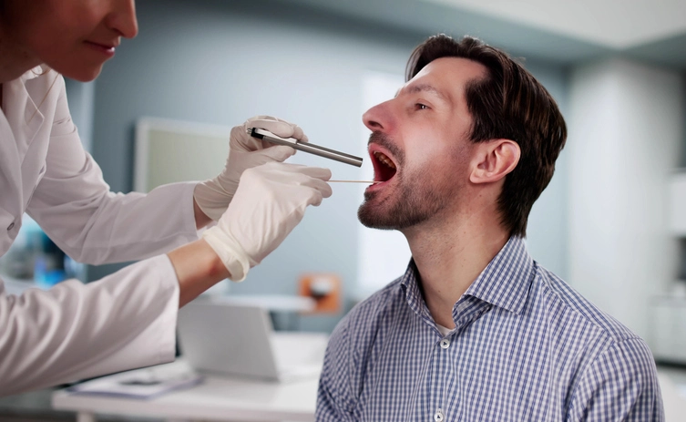 man being tested for strep throat 