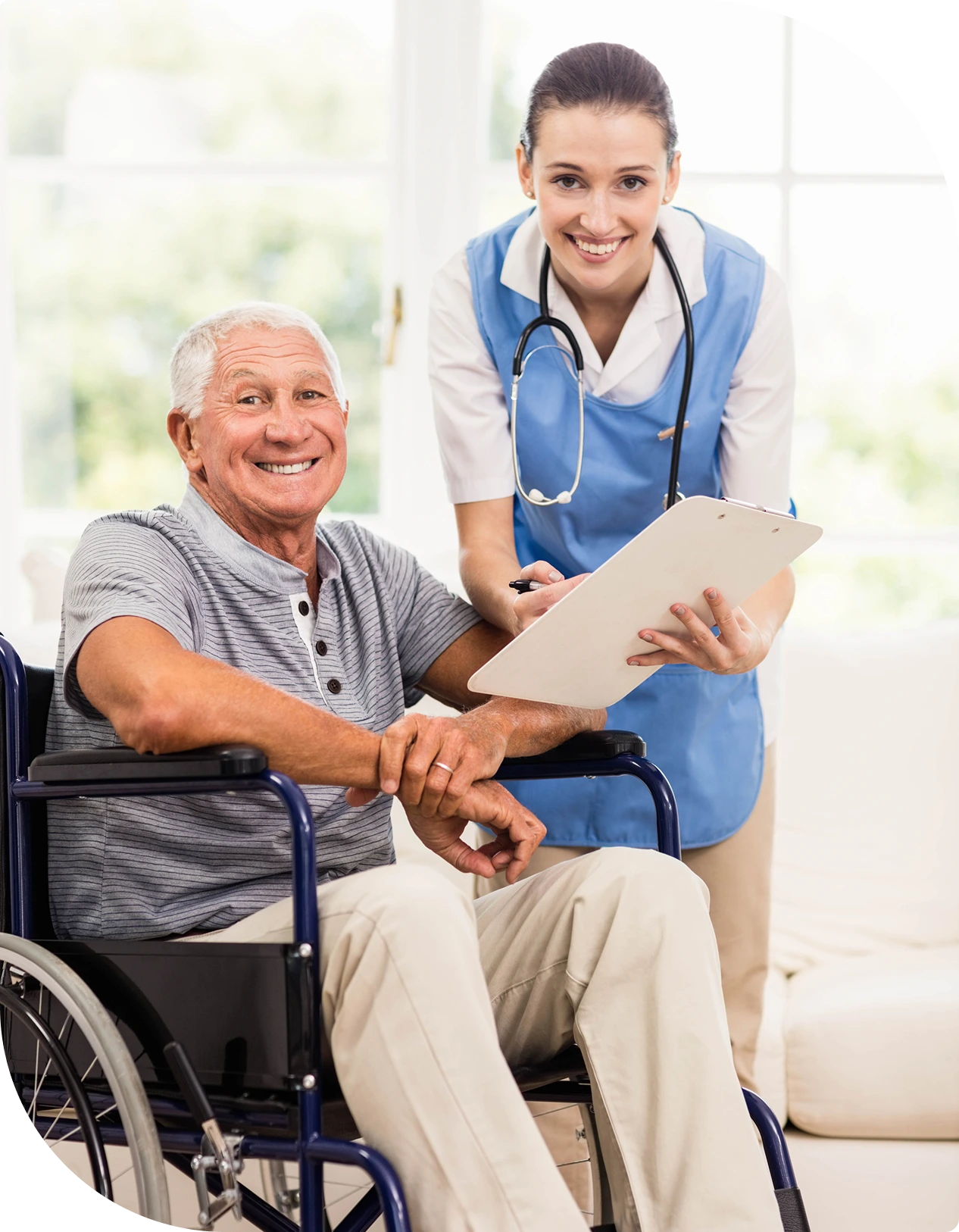 Austin Emergency Center — nurse helping smiling elderly man in wheelchair.