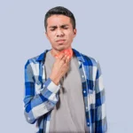Man holding throat with pain, sore throat discomfort